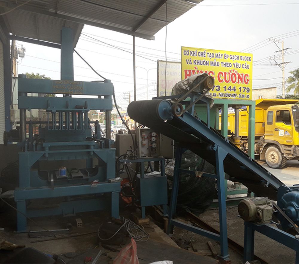 Day chuyen may ep gach